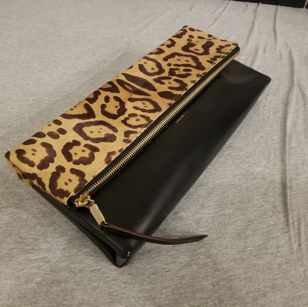 Coach Foldover Leather and suede Clutch Bag.